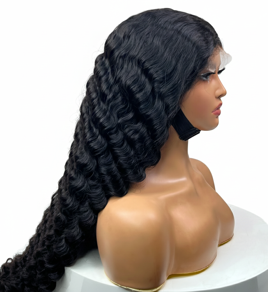 Black wig  on a mannequin head against a white background